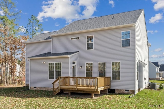 rear view of house featuring a wooden deck, a yard, and central AC