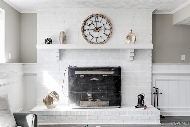 details with hardwood / wood-style flooring and crown molding