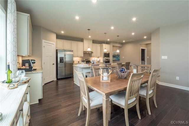 dining space featuring dark wood-type flooring