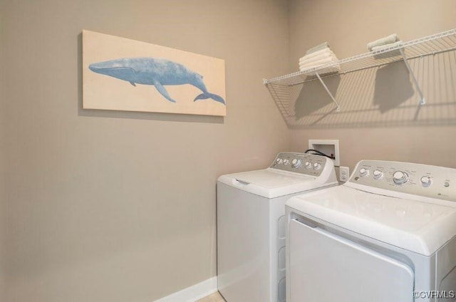 washroom featuring washer and clothes dryer