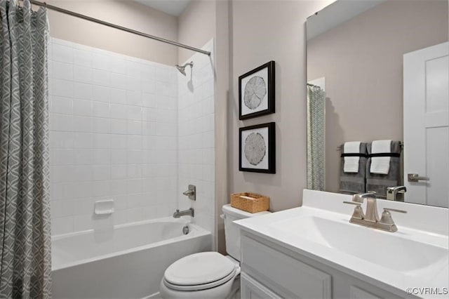 full bathroom featuring shower / bath combo, vanity, and toilet