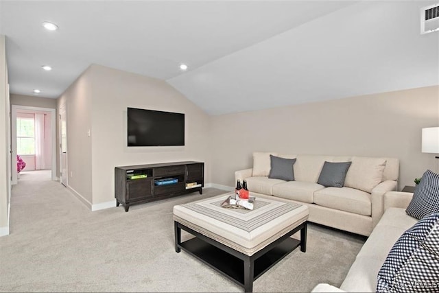 living room featuring light colored carpet and lofted ceiling