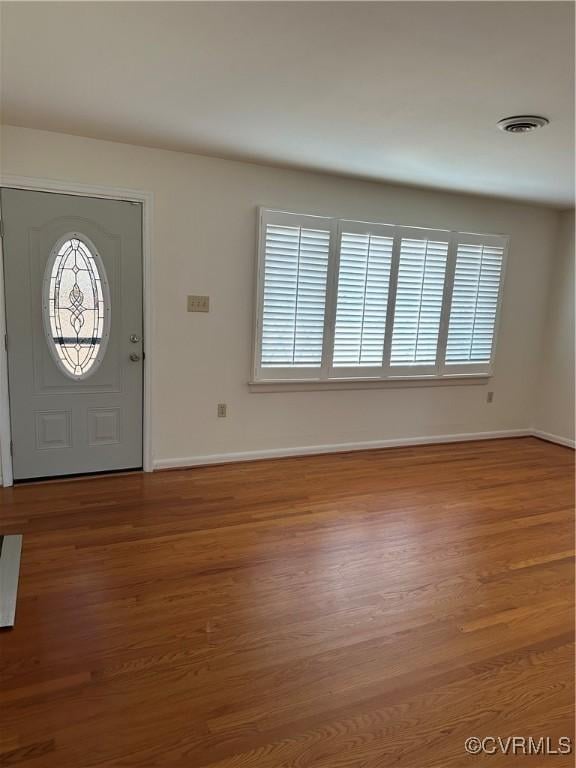 entryway with wood-type flooring