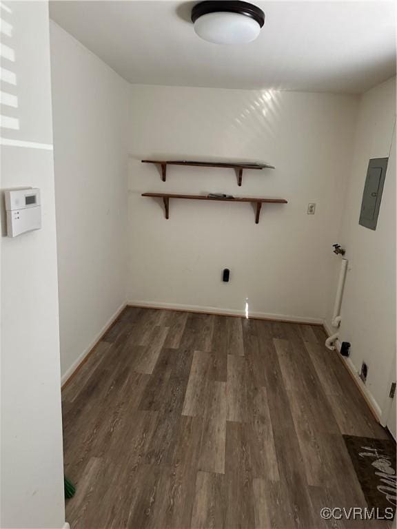 washroom with hookup for a washing machine, dark hardwood / wood-style floors, and electric panel