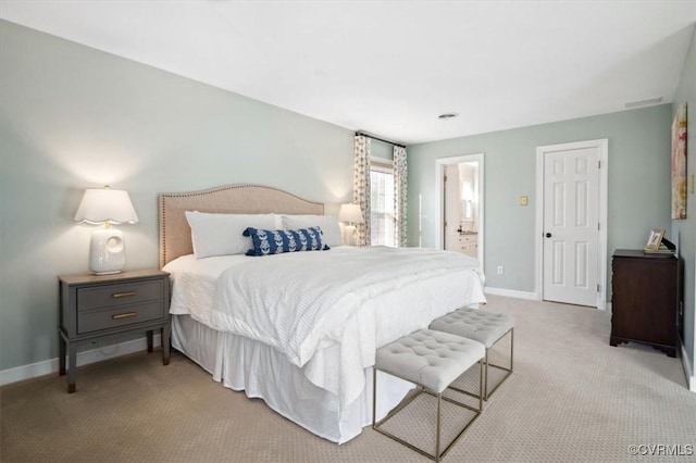 carpeted bedroom with ensuite bathroom