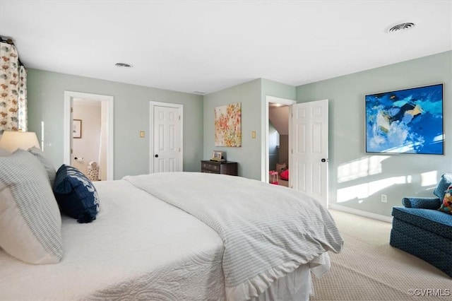 bedroom with light colored carpet