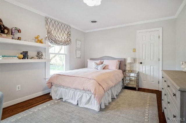 bedroom featuring dark wood-type flooring and crown molding