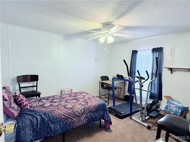 bedroom with carpet floors, a textured ceiling, and ceiling fan