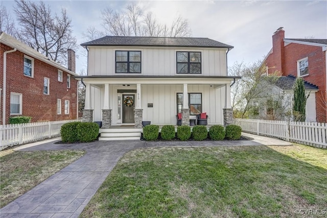 view of front of house with a porch and a front yard