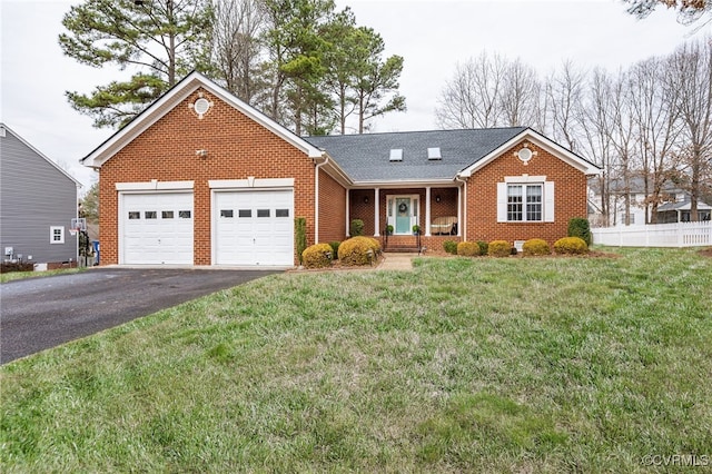 view of front of house featuring a porch, a garage, and a front yard