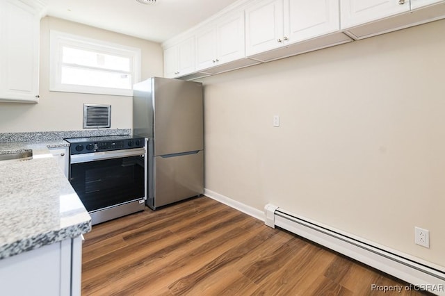 kitchen featuring electric range oven, stainless steel refrigerator, white cabinetry, a baseboard heating unit, and dark wood-type flooring