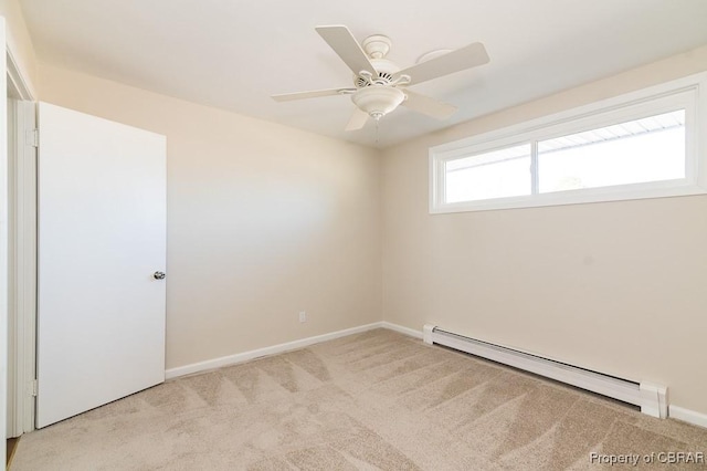 empty room featuring light carpet, ceiling fan, and baseboard heating