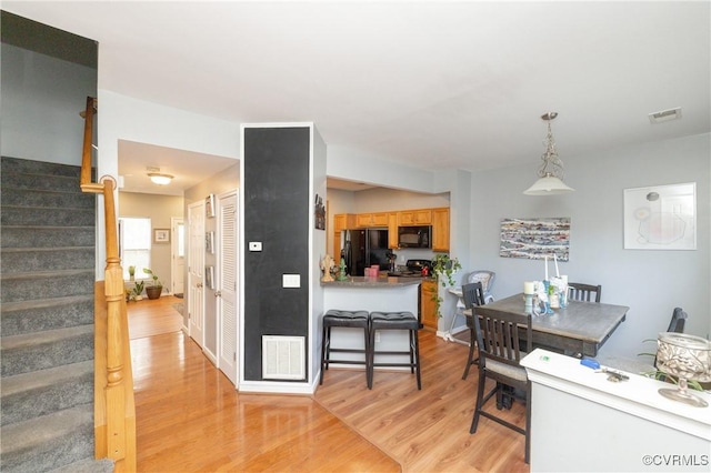 dining space featuring light hardwood / wood-style flooring