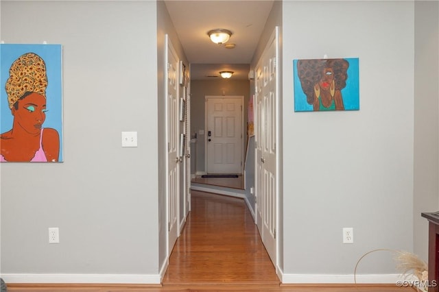 corridor featuring wood-type flooring