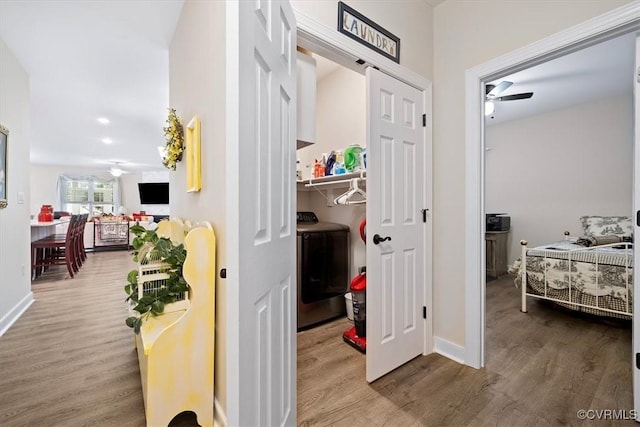 corridor with hardwood / wood-style floors