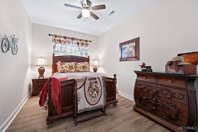 bedroom with ceiling fan and light wood-type flooring