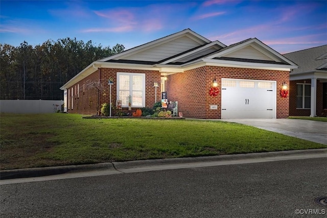 view of front of home featuring a garage and a lawn