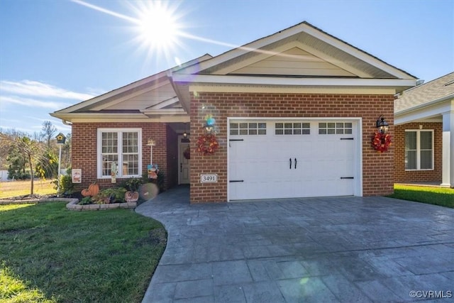 view of front of home with a garage and a front yard