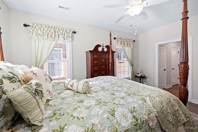 bedroom featuring dark hardwood / wood-style floors and ceiling fan