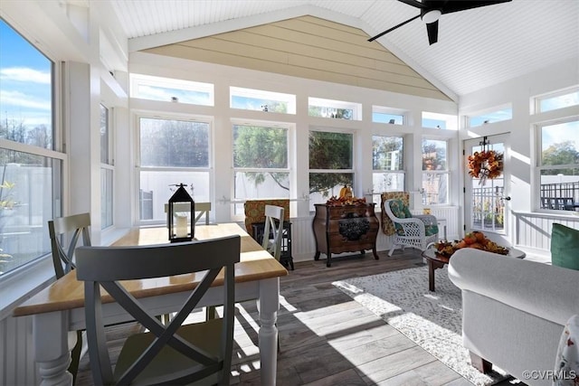 sunroom / solarium featuring ceiling fan and vaulted ceiling