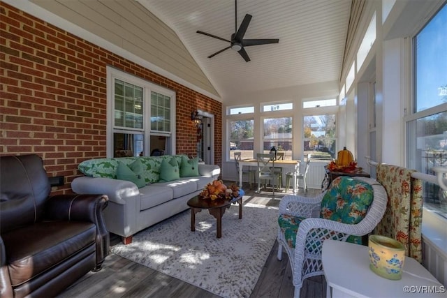 sunroom / solarium with lofted ceiling and ceiling fan