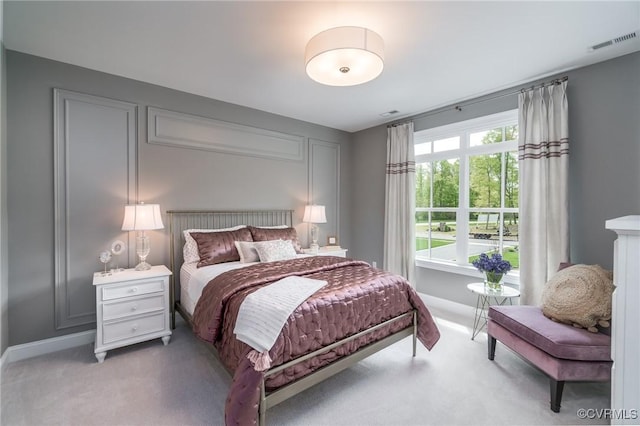 bedroom with light colored carpet