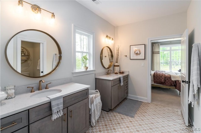 bathroom featuring vanity and a healthy amount of sunlight