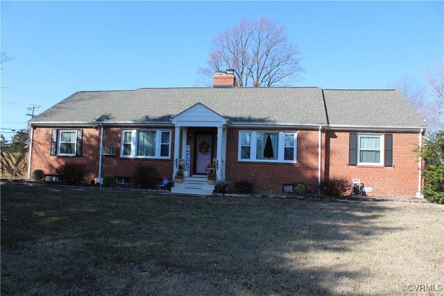 single story home featuring a front yard