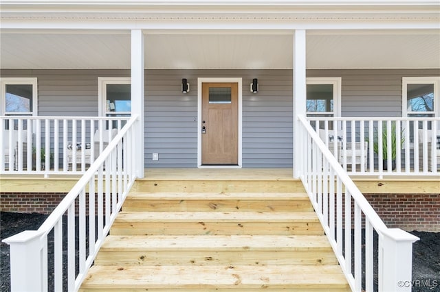 doorway to property with a porch