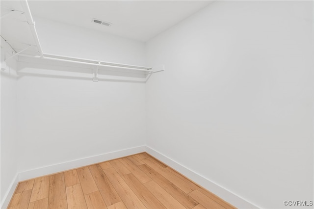 walk in closet featuring wood-type flooring