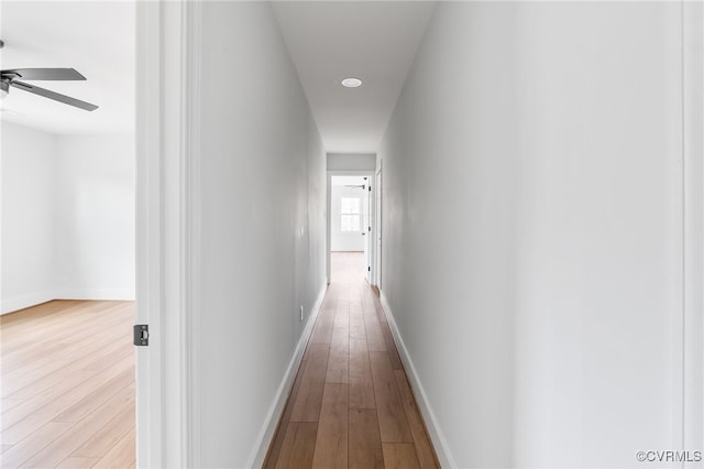 corridor with light wood-type flooring