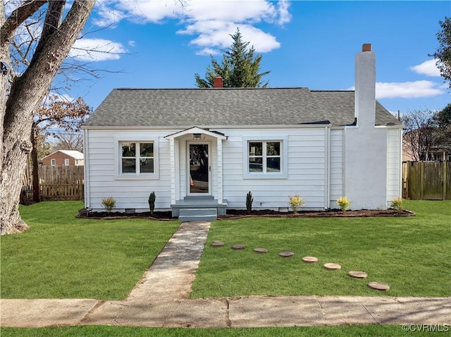 view of front of property with a front lawn