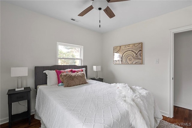 bedroom with dark wood-type flooring and ceiling fan