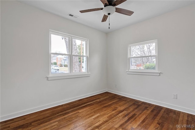 spare room with hardwood / wood-style flooring and ceiling fan