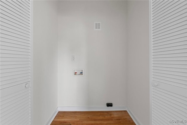 laundry area featuring hookup for a washing machine and wood-type flooring