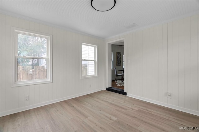 unfurnished room featuring light hardwood / wood-style flooring