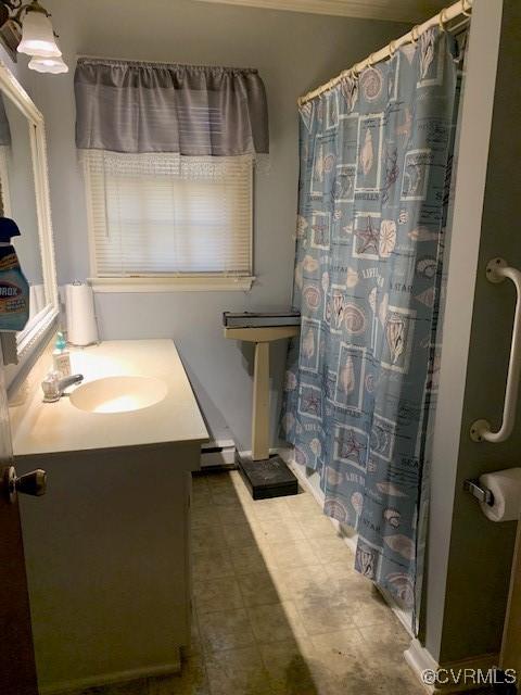 202 W York Dr, Emporia, VA 23847 - bathroom featuring walk in shower, a baseboard radiator, and vanity