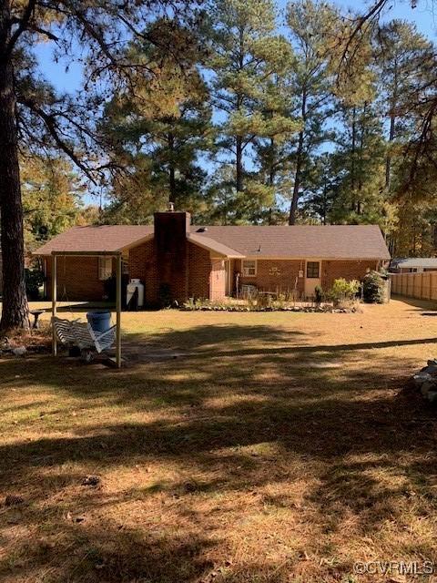 202 W York Dr, Emporia, VA 23847 - back of property with a carport and a lawn