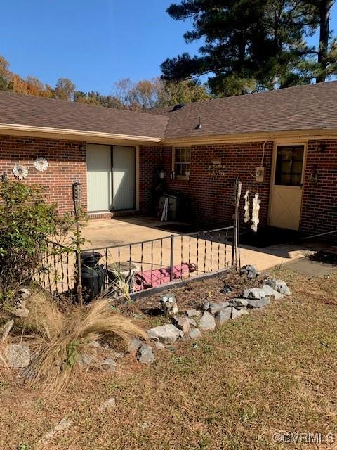 202 W York Dr, Emporia, VA 23847 - rear view of house featuring a patio