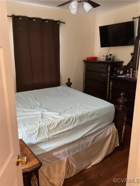 bedroom featuring ceiling fan and dark hardwood / wood-style flooring