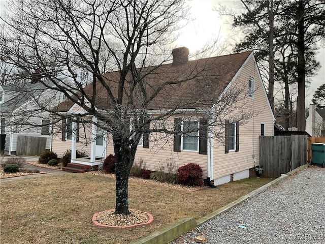 view of home's exterior with a lawn