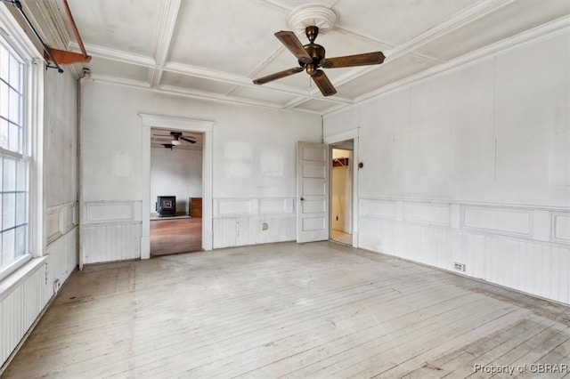 unfurnished room featuring ceiling fan, coffered ceiling, and light wood-type flooring