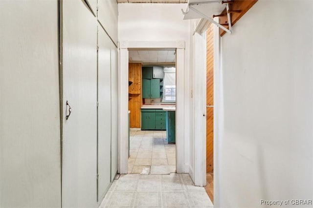 corridor featuring a paneled ceiling