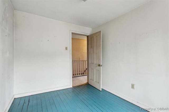 unfurnished room featuring hardwood / wood-style floors