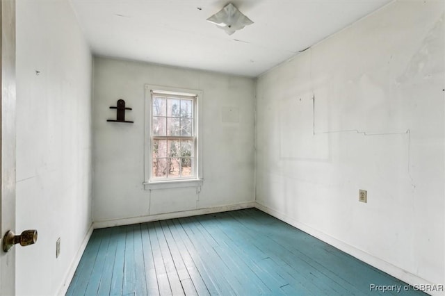 unfurnished room featuring hardwood / wood-style flooring