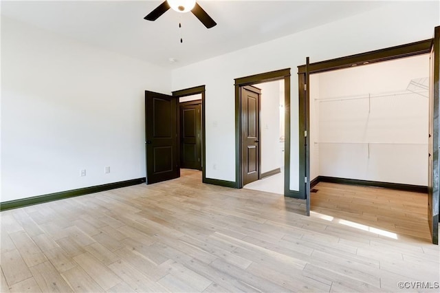 unfurnished bedroom featuring light hardwood / wood-style flooring and ceiling fan