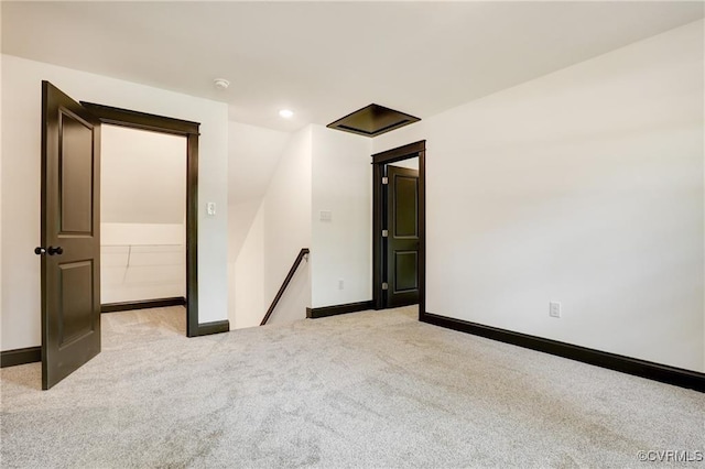 spare room featuring light colored carpet