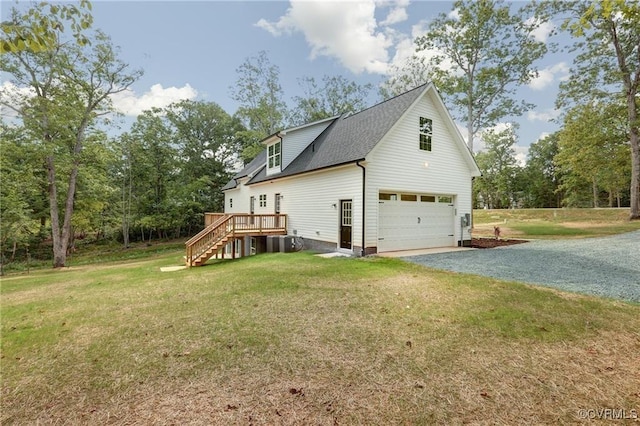 view of side of property with a wooden deck and a lawn