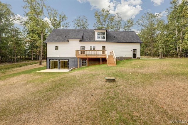 back of house with central AC unit, a patio, a yard, and a deck