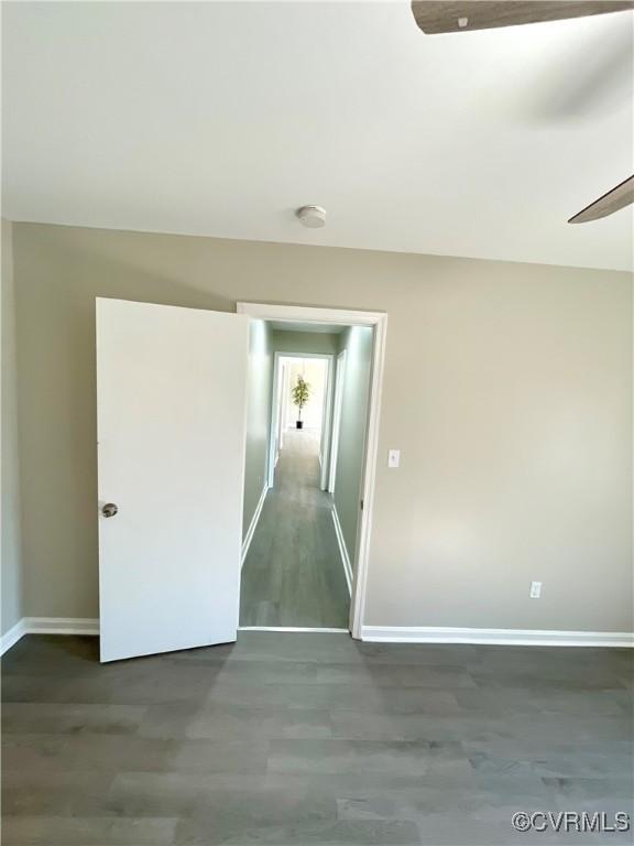 empty room featuring dark hardwood / wood-style flooring